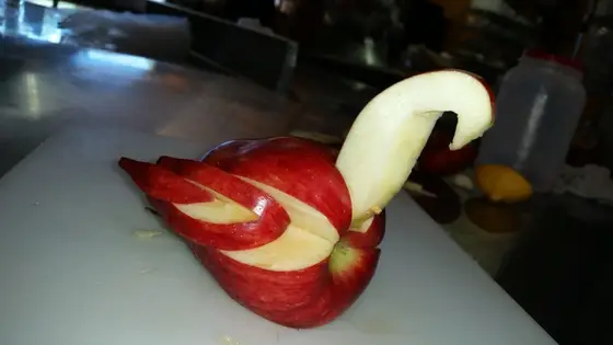 An apple carved into a swan